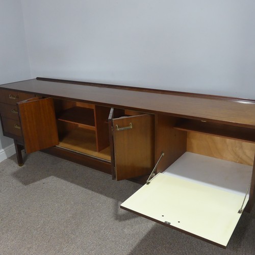 598 - A 1960's G-Plan teak Sideboard by E Gomme, central cupboard with folding doors, drop down front and ... 