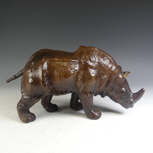 576 - An Abercrombie & Fitch style leather model of a Rhinoceros, affectionately known by the vendor a... 