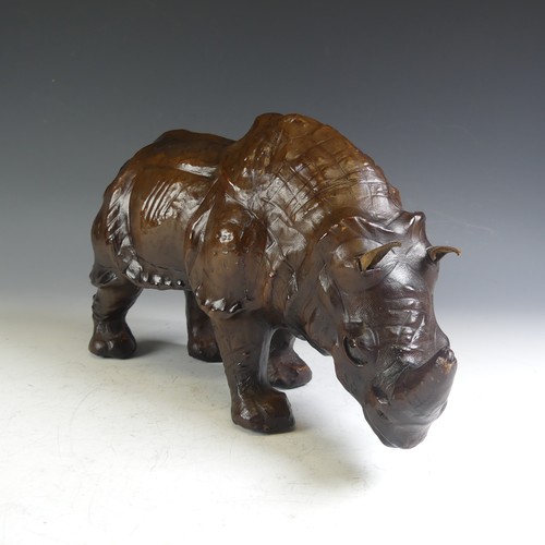 576 - An Abercrombie & Fitch style leather model of a Rhinoceros, affectionately known by the vendor a... 