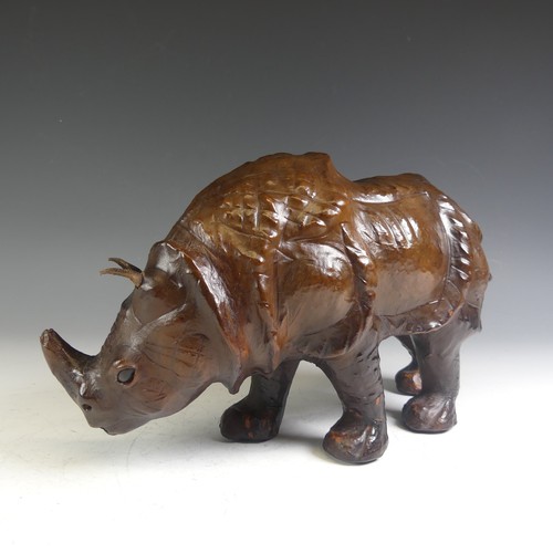 576 - An Abercrombie & Fitch style leather model of a Rhinoceros, affectionately known by the vendor a... 