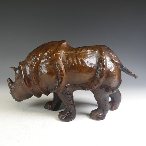 576 - An Abercrombie & Fitch style leather model of a Rhinoceros, affectionately known by the vendor a... 