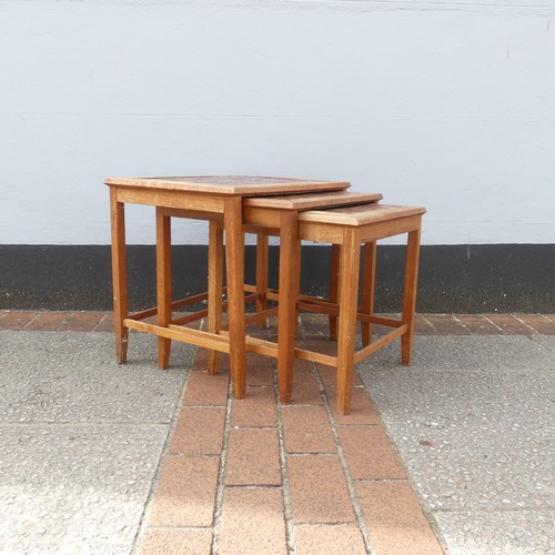 600 - Mid-20th century nest of three teak-framed tile-top tables, largest W:56cm x D:40.5cm x H:48cm, smal... 