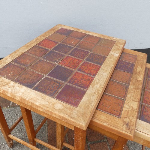 600 - Mid-20th century nest of three teak-framed tile-top tables, largest W:56cm x D:40.5cm x H:48cm, smal... 