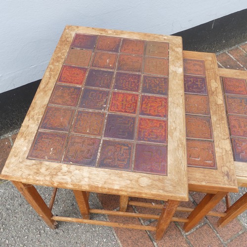 600 - Mid-20th century nest of three teak-framed tile-top tables, largest W:56cm x D:40.5cm x H:48cm, smal... 