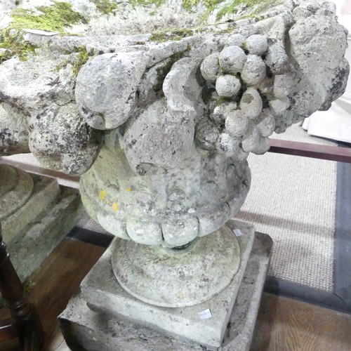 618 - A Pair of weathered stoneware garden Urns, with moulded floral borders, raised on plinth base, W 58 ... 