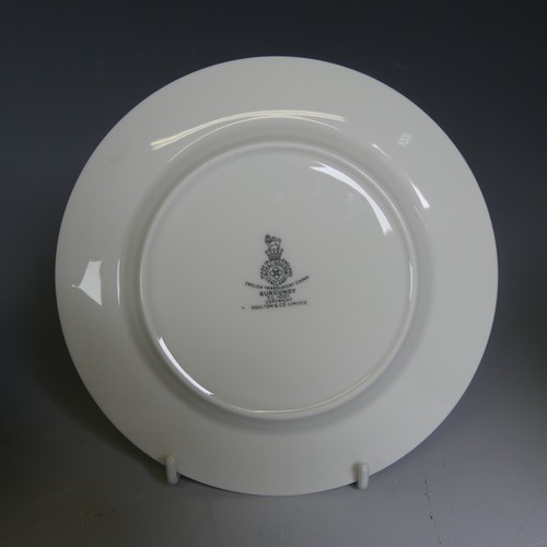 65 - A Royal Doulton 'Burgundy' pattern part Dinner Service, comprising Dinner Plates, Tureens, etc. (a l... 