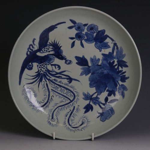 87 - A Chinese blue and white Charger, with underglaze decoration of pheonix and chrysanthemum some decor... 