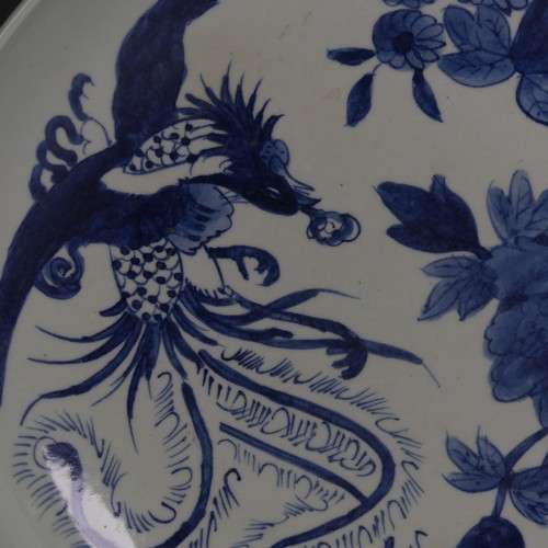 87 - A Chinese blue and white Charger, with underglaze decoration of pheonix and chrysanthemum some decor... 