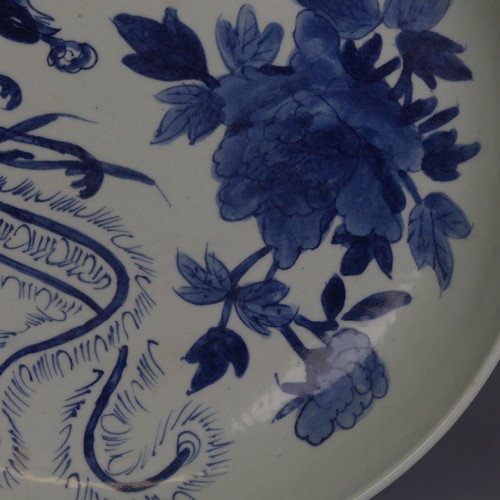 87 - A Chinese blue and white Charger, with underglaze decoration of pheonix and chrysanthemum some decor... 