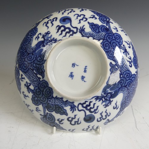 91 - An antique Chinese blue and white porcelain Footed Dish, decorated underglaze with dragons, with fou... 