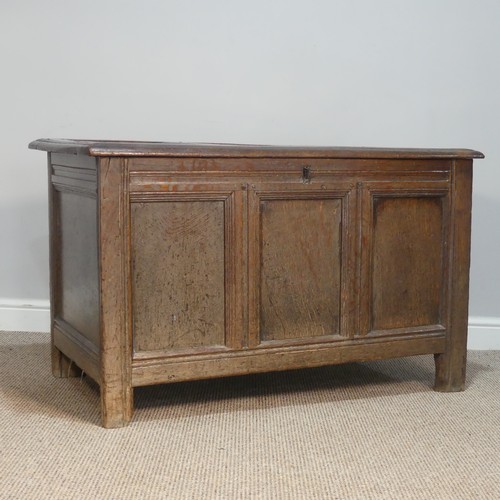 384 - An 18thC panelled oak Coffer, raised on square feet, W 109 cm x H 66 cm x D 56 cm.