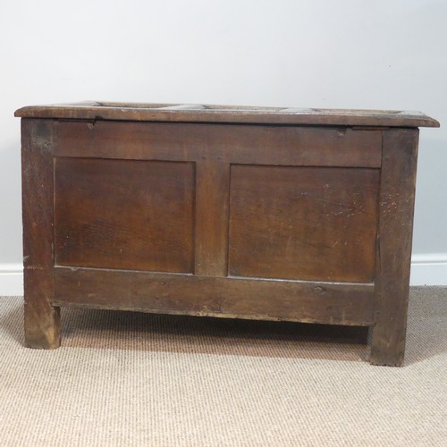 384 - An 18thC panelled oak Coffer, raised on square feet, W 109 cm x H 66 cm x D 56 cm.