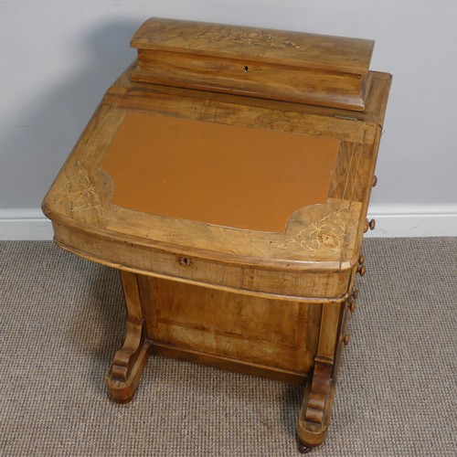 387 - A Victorian inlaid slopefront walnut Davenport, with writing skiver, above four drawers and four dum... 