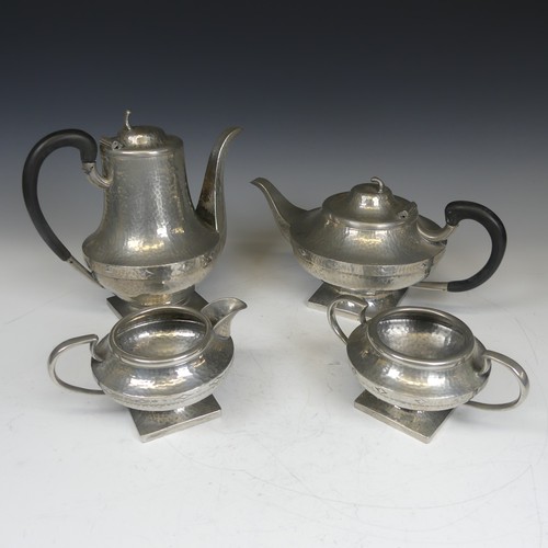 388 - An Art Nouveau hammered four piece pewter Tea set, stamped to base(4)