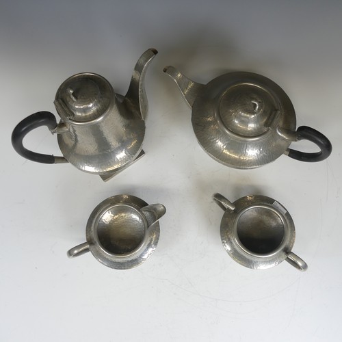 388 - An Art Nouveau hammered four piece pewter Tea set, stamped to base(4)