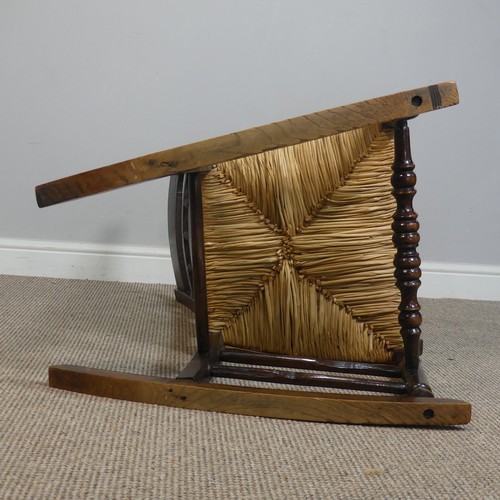 389 - An Antique elm Rocking Chair, with rush seat, W 50.5 cm x H 102 cm x D 67 cm.