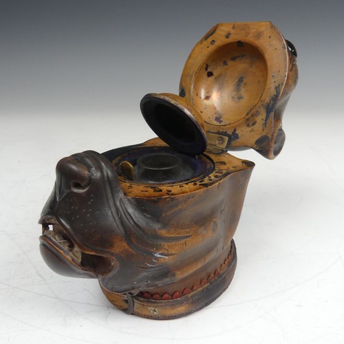 391 - A late Victorian novelty treen Inkwell, modelled as a boxer dog head, with glass eyes and leather co... 