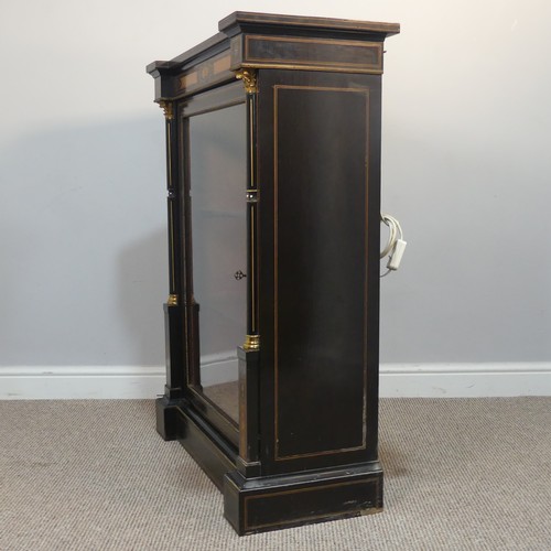 393 - A pair of 19th century gilt mounted ebonised Pier Cabinets, each with an oversailing rectangular top... 