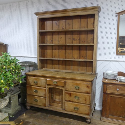 395 - An Antique pine Dresser, moulded cornice above three shelves with hooks, raised on dresser base with... 