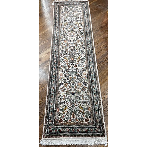 521 - Tribal Rugs; a hand-knotted Persian Tabriz runner, wool pile on cotton base, cream ground woven with... 