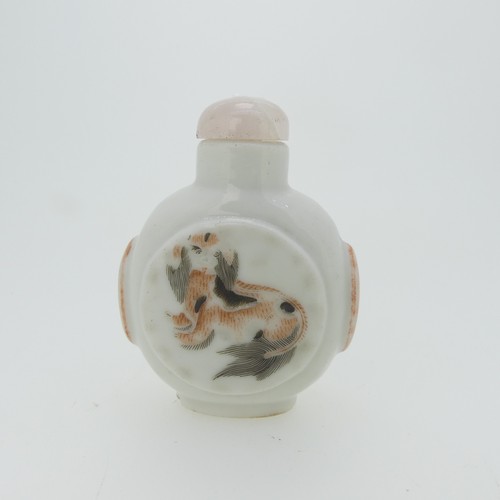 96 - A Chinese famille rose porcelain Snuff Bottle, the white ground decorated with enamels of a grasshop... 