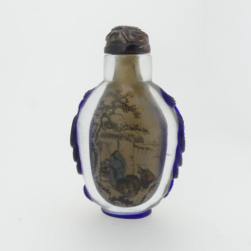 99 - A Chinese interior painted and overlayed glass Snuff Bottle, with interior scene of villagers enclos... 