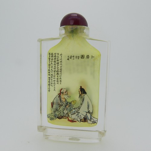 100 - A Chinese glass Snuff Bottle, of yellow ground painted with floral enamels, red stone stopper, three... 