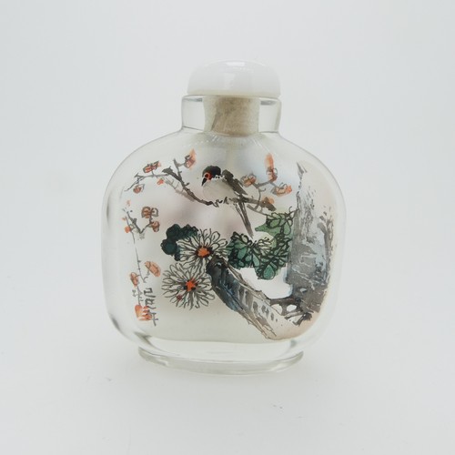 100 - A Chinese glass Snuff Bottle, of yellow ground painted with floral enamels, red stone stopper, three... 