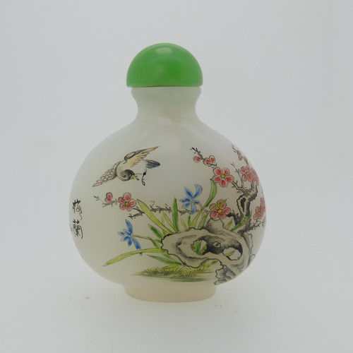 100 - A Chinese glass Snuff Bottle, of yellow ground painted with floral enamels, red stone stopper, three... 