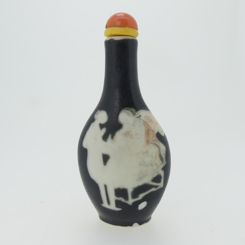 101 - A Chinese porcelain Snuff Bottle, depicting iron red Dragons on green ground, character mark to base... 