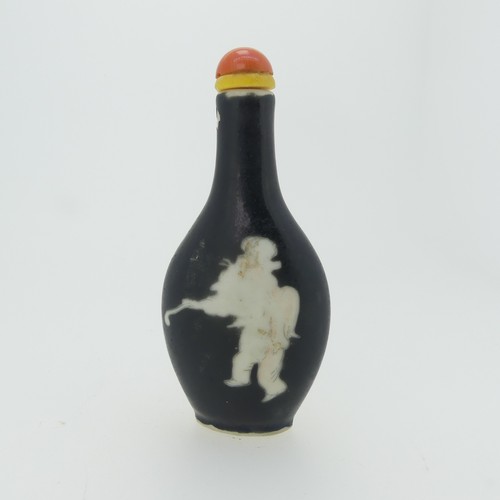 101 - A Chinese porcelain Snuff Bottle, depicting iron red Dragons on green ground, character mark to base... 