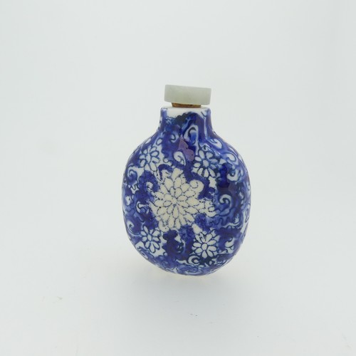 101 - A Chinese porcelain Snuff Bottle, depicting iron red Dragons on green ground, character mark to base... 