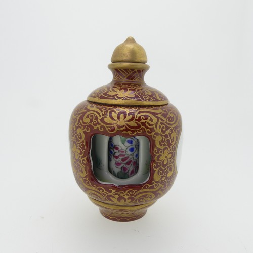 101 - A Chinese porcelain Snuff Bottle, depicting iron red Dragons on green ground, character mark to base... 