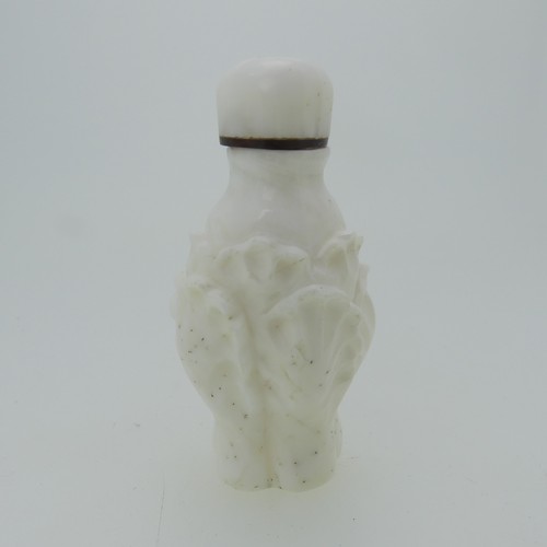 104 - A Chinese rose quartz Snuff Bottle, carved in reflief with flora and fauna, H 9cm, together with an ... 