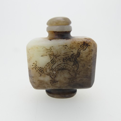 104 - A Chinese rose quartz Snuff Bottle, carved in reflief with flora and fauna, H 9cm, together with an ... 