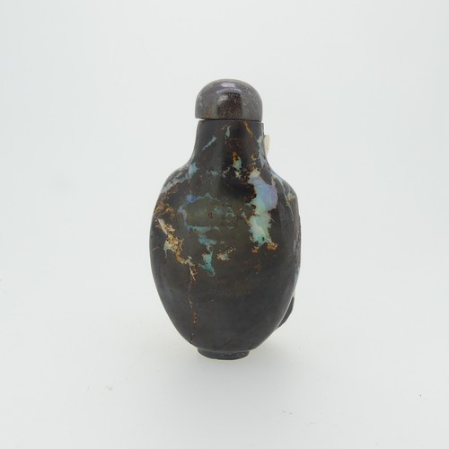 105 - A Chinese opal matrix Snuff Bottle, the matrix body with carved depicting a crane amongst flora, wit... 