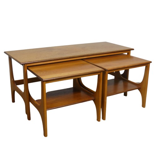 404 - A retro mid 20th century teak nest of Tables / coffee Table, the three tables having one long and tw... 