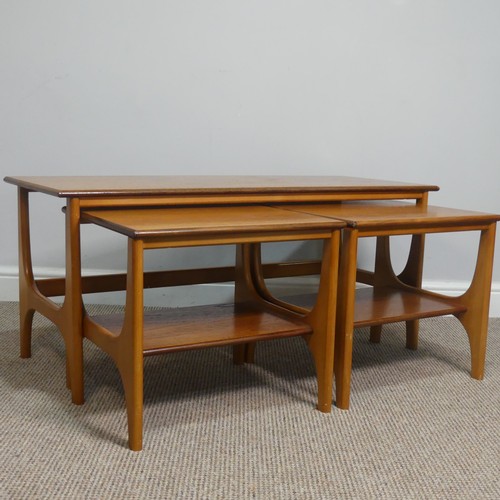 404 - A retro mid 20th century teak nest of Tables / coffee Table, the three tables having one long and tw... 