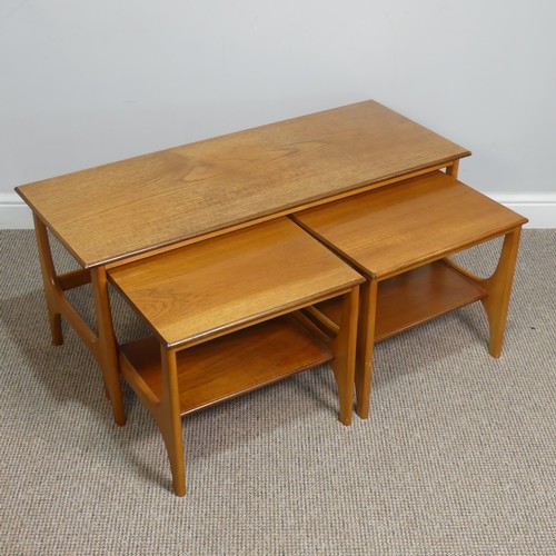 404 - A retro mid 20th century teak nest of Tables / coffee Table, the three tables having one long and tw... 