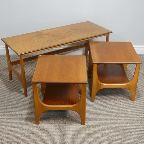 404 - A retro mid 20th century teak nest of Tables / coffee Table, the three tables having one long and tw... 