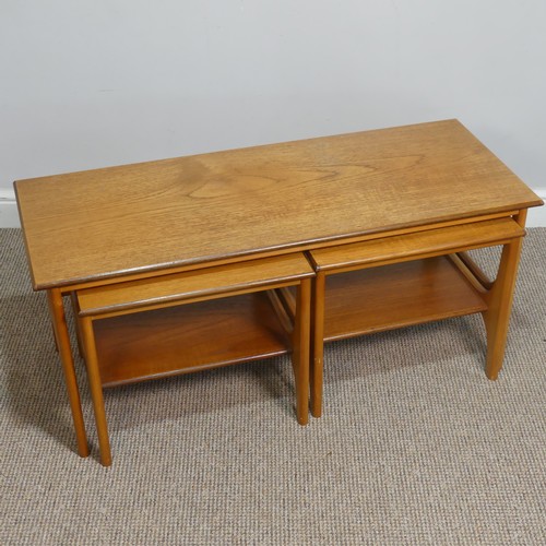 404 - A retro mid 20th century teak nest of Tables / coffee Table, the three tables having one long and tw... 