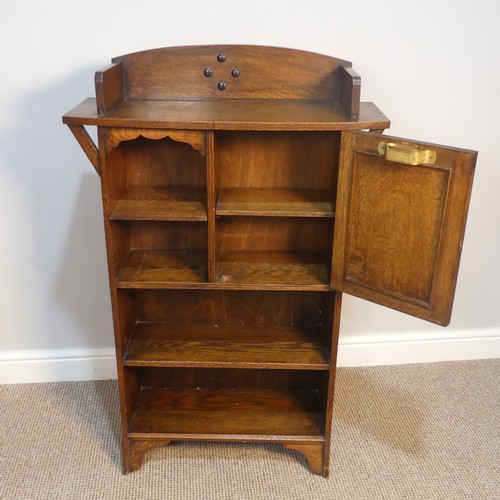 406 - An Arts and Crafts oak Bookcase with cupboard, in the manner of Liberty, W 67 cm x H 104 cm x D 25 c... 