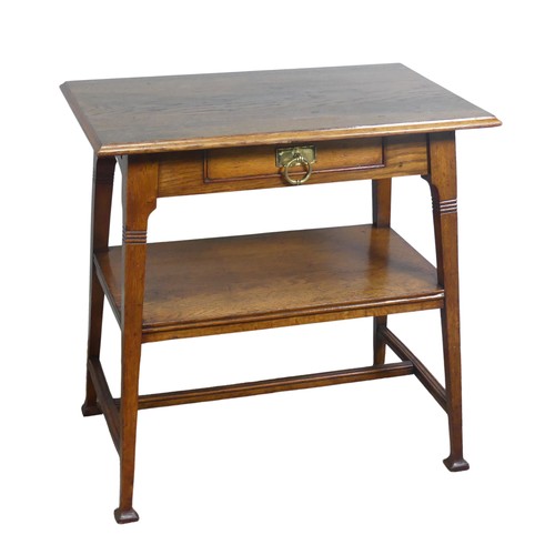 407 - An Arts and Crafts oak side Table, in the manner of Liberty, with fake drawer raised on reeded suppo... 