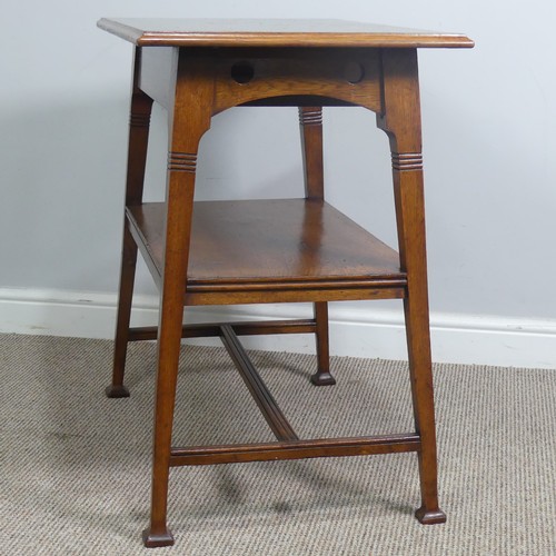 407 - An Arts and Crafts oak side Table, in the manner of Liberty, with fake drawer raised on reeded suppo... 