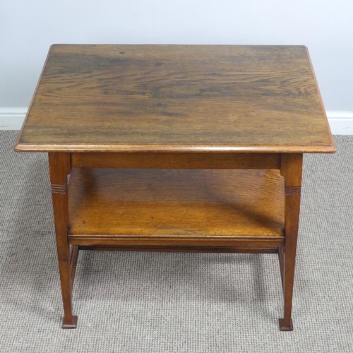 407 - An Arts and Crafts oak side Table, in the manner of Liberty, with fake drawer raised on reeded suppo... 