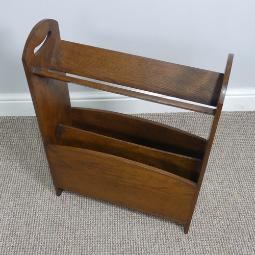 410 - An Arts and Crafts oak magazine Stand with book rest to top, In the manner of Liberty with pierced s... 