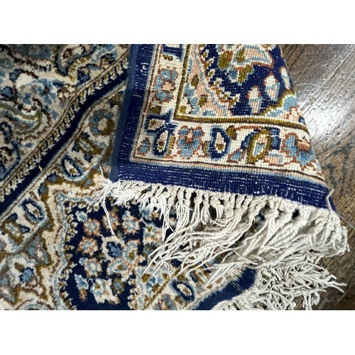 522 - Tribal Rugs; a Persian hand knotted rug, wool pile on cotton base, the royal blue ground with centra... 