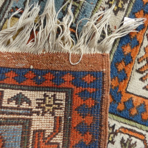 523 - Tribal Rugs; a Turkish hand knotted 100% wool rug, the orange ground woven with bold geometric patte... 