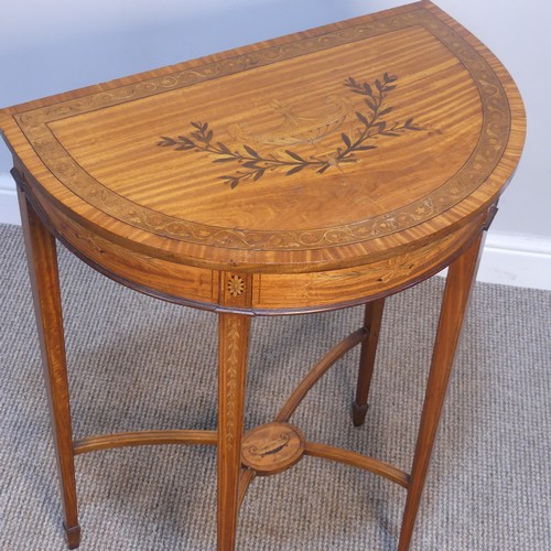 418 - An Antique style satinwood small demilune inlaid side Table, raised on inlaid tapering legs upon spa... 