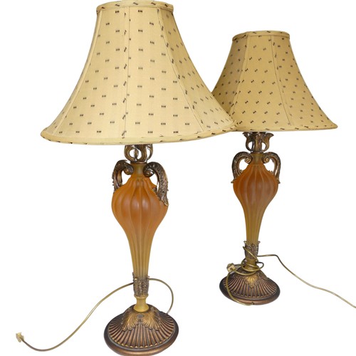 419 - A pair of Antique frosted amber resin and gilt wood table Lamps, H 76 cm.